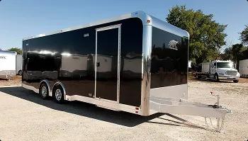 Enclosed transport trailer for secure shipping black enclosed car trailer parked outdoors showing secure transport option