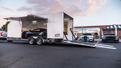 Enclosed auto transport luxury cars enclosed trailer loading luxury sports cars for safe and secure transport