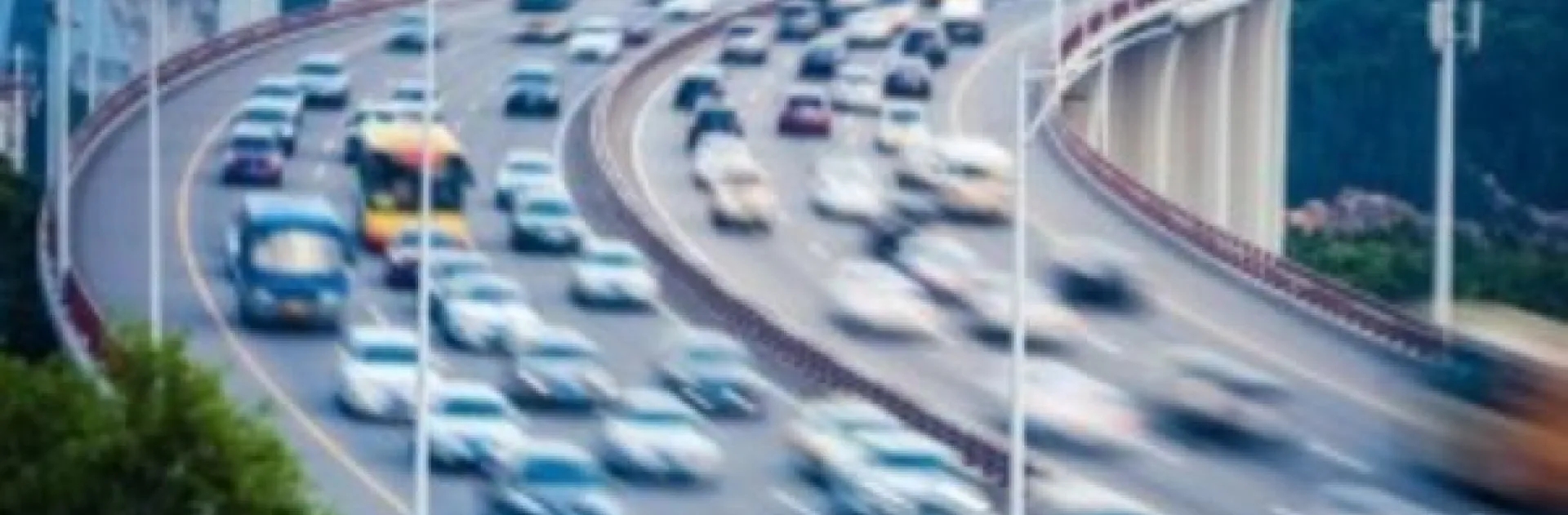 Expedited car shipping hero blurred highway traffic showing fast vehicle transport for expedited service