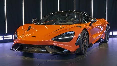 Luxury car shipping for exotic supercars orange exotic supercar under studio lights representing luxury car shipping