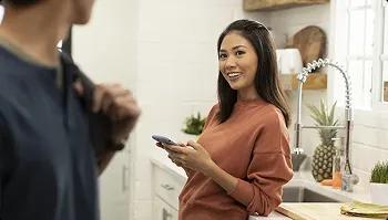 Home pickup coordination woman texting to coordinate car pickup at home