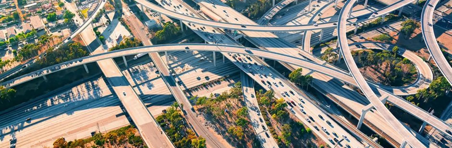 Ship a car to another state hero aerial view of multi level freeway interchange representing state to state car shipping