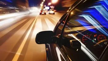 Fast pickup and delivery at night car driving at night with motion blur symbolizing fast pickup and delivery