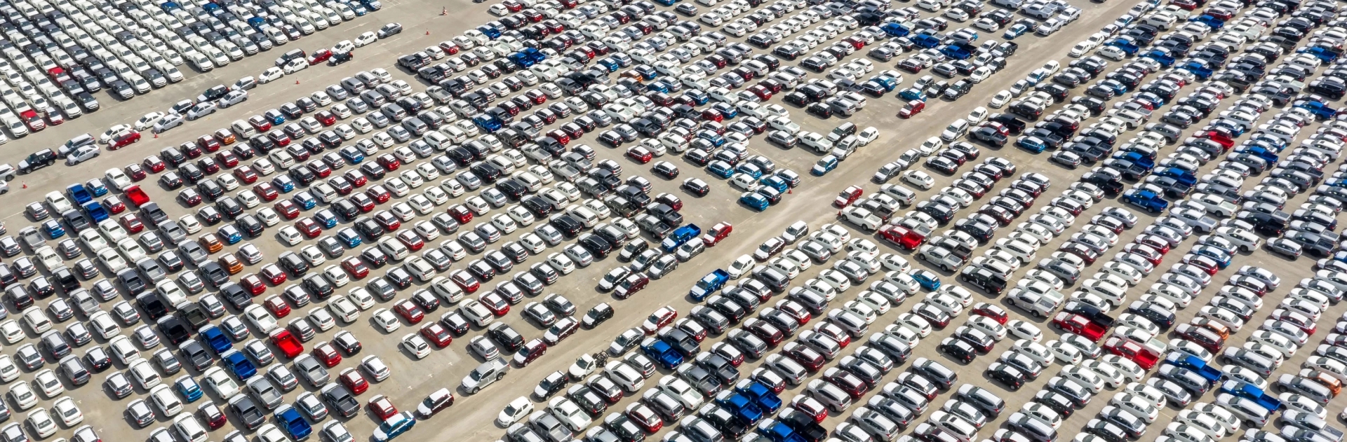 Auto auction car shipping Aerial view of a crowded auto auction parking lot filled with vehicles