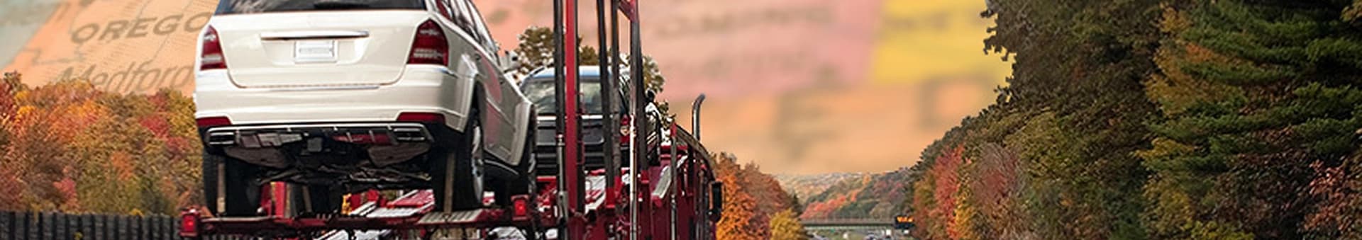 Open carrier transporting vehicles in fall open car carrier hauling vehicles on an interstate during the fall season