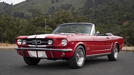 Classic convertible car transport service red classic convertible car parked on mountain road representing collector car transport