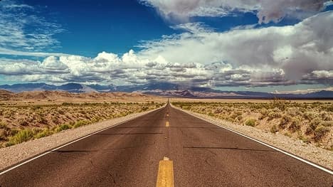 Open highway for cross country routes open desert highway representing cross country car shipping routes