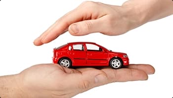 Auto transport insurance safety hands protecting a red car symbolizing auto transport insurance coverage