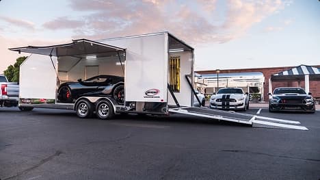 Enclosed auto transport luxury cars enclosed trailer loading luxury sports cars for safe and secure transport