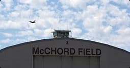 McChord Field flight line and control tower mcchord field hangar with control tower and aircraft overhead symbolizing pcs moves
