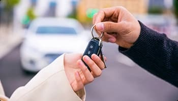 Car keys handoff handing over car keys during pickup or delivery
